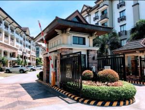 a building with a gate in front of a street at One Oasis 2BR beside SM City Mall upto 6pax in Davao City