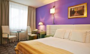 Postel nebo postele na pokoji v ubytování Hotel Phoenix