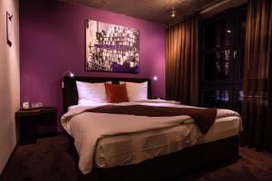 
Ein Bett oder Betten in einem Zimmer der Unterkunft Altes Stahlwerk Business & Lifestyle Hotel
