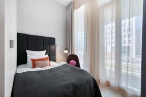Postel nebo postele na pokoji v ubytování Clarion Hotel Oslo