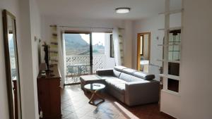 Posezení v ubytování Apartamento amplio y tranquilo con vistas