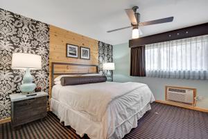 a bedroom with a bed and a ceiling fan at 3 Peaks Resort & Beach Club in South Lake Tahoe