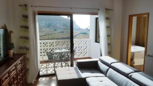 Posezení v ubytování Apartamento amplio y tranquilo con vistas