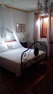 Ένα ή περισσότερα κρεβάτια σε δωμάτιο στο Il Papavero b&b relais