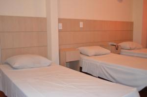 Postel nebo postele na pokoji v ubytování Lux Hotel