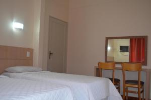Postel nebo postele na pokoji v ubytování Lux Hotel