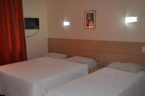 Postel nebo postele na pokoji v ubytování Lux Hotel