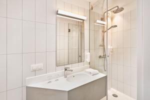 Kylpyhuone majoituspaikassa H+ Hotel Wien