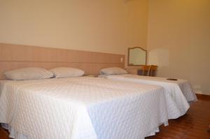Postel nebo postele na pokoji v ubytování Lux Hotel