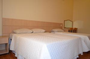Postel nebo postele na pokoji v ubytování Lux Hotel