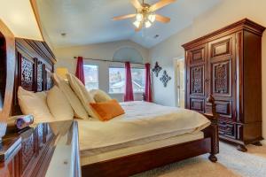 a bedroom with a large bed and a ceiling fan at Oaks at Wasatch #5 in Cottonwood Heights