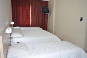 Postel nebo postele na pokoji v ubytování Lux Hotel