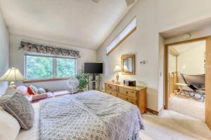 a bedroom with a bed and a large window at The Woods: Townhouse-F3 in Killington +37 photos