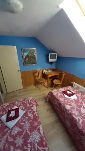 Postel nebo postele na pokoji v ubytování Guest House Uzhgorod