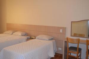 Postel nebo postele na pokoji v ubytování Lux Hotel