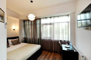Ein Bett oder Betten in einem Zimmer der Unterkunft Tbilisi Check In