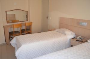 Postel nebo postele na pokoji v ubytování Lux Hotel