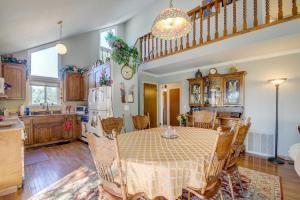 a kitchen and dining room with a table and a staircase at Pine Hideaway (01/247) in Groveland