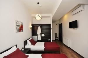Ein Bett oder Betten in einem Zimmer der Unterkunft Tbilisi Check In