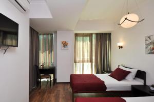 Ein Bett oder Betten in einem Zimmer der Unterkunft Tbilisi Check In