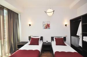 Ein Bett oder Betten in einem Zimmer der Unterkunft Tbilisi Check In