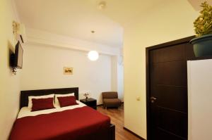 Ein Bett oder Betten in einem Zimmer der Unterkunft Tbilisi Check In