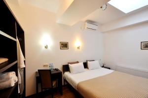 Ein Bett oder Betten in einem Zimmer der Unterkunft Tbilisi Check In