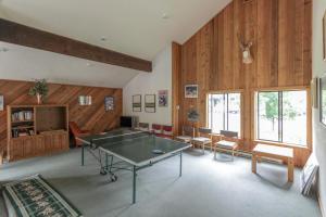 a ping pong table in a room with wooden walls at Western Welcome in Sun Valley