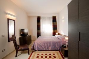 Postel nebo postele na pokoji v ubytování Hotel Massimino