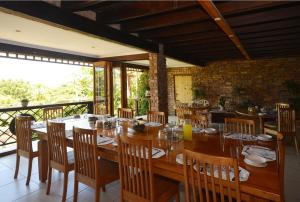 a dining room with a large wooden table and chairs at IRONWOOD LODGE in Pennington