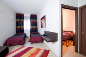 Postel nebo postele na pokoji v ubytování Hotel Massimino