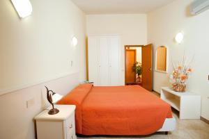 Postel nebo postele na pokoji v ubytování Hotel Massimino