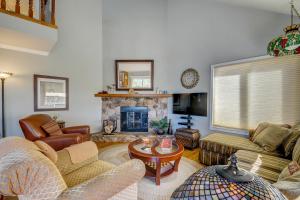 a living room with a couch and a fireplace at Pine Hideaway (01/247) in Groveland