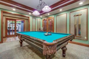 a pool table in a room with a ceiling at Powderhorn Lodge 408: Rustic Mountain Suite in Solitude
