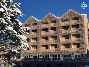 a large building with a large window on top of it at The People - Les 2 Alpes in Les Deux Alpes