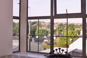 a room with a window looking out at a city at Apartment 3, Oakleigh House, Donnybrook Hill, Douglas Cork in Cork +2 photos