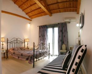Кровать или кровати в номере Malemi Organic Hotel