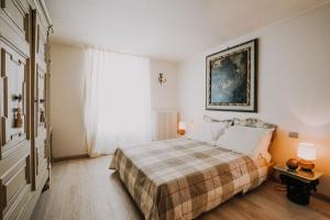 Postel nebo postele na pokoji v ubytování Casa Luigi Ariano