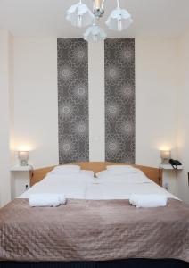 Posteľ alebo postele v izbe v ubytovaní Hotel Papillon