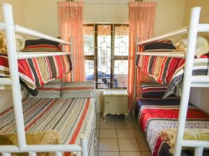 Ένα ή περισσότερα κρεβάτια σε δωμάτιο στο MAMA MIA COTTAGES OSLO BEACH