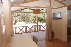 a dining room with a view of a balcony at Finca El Abuelo in Barbate