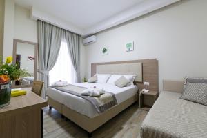 Postel nebo postele na pokoji v ubytování Hotel del Sole
