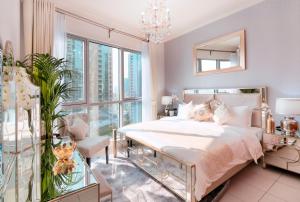 a bedroom with a bed and a table with a mirror at Elite Royal Apartment - Full Burj Khalifa and Fountain View - Caesar in Dubai +28 photos
