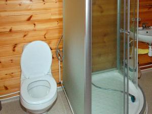a bathroom with a toilet and a glass shower at 5 person holiday home in VÅGLAND in Bårdset +39 photos