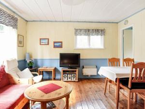 A television and/or entertainment centre at 8 person holiday home in S LEN