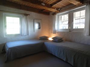 Voodi või voodid majutusasutuse Guesthouse Les Mignardises toas