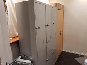 a row of lockers in a room at Abbotsford Private Rooms & Pods - 15 Charles Homestay in Melbourne