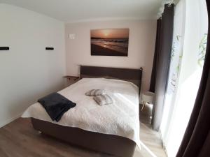 Postel nebo postele na pokoji v ubytování Ferienwohnung Strandräuber