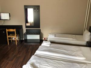 Ein Bett oder Betten in einem Zimmer der Unterkunft Pension Reiter