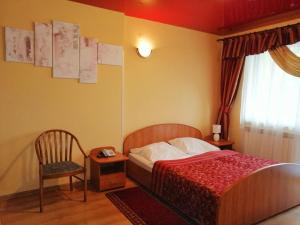 Кровать или кровати в номере Hotel Grodzki